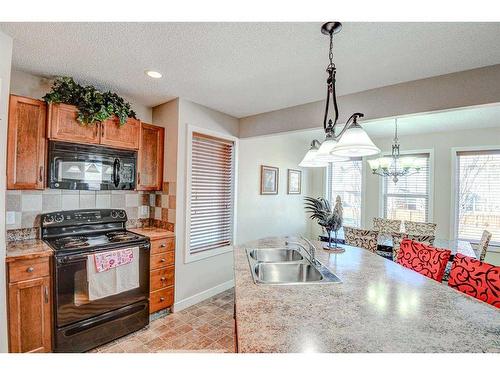 274 Covecreek Close Ne, Calgary, AB - Indoor Photo Showing Kitchen With Double Sink