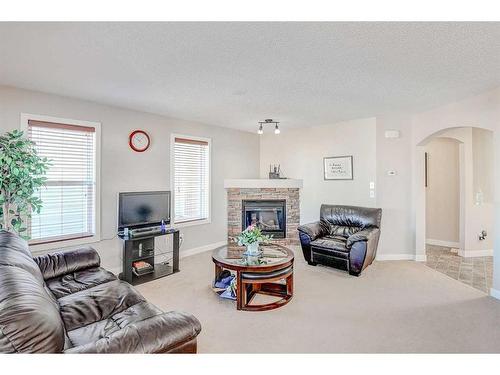 274 Covecreek Close Ne, Calgary, AB - Indoor Photo Showing Living Room With Fireplace