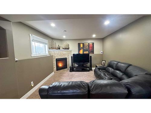 205 12Th Avenue Ne, Sundre, AB - Indoor With Fireplace