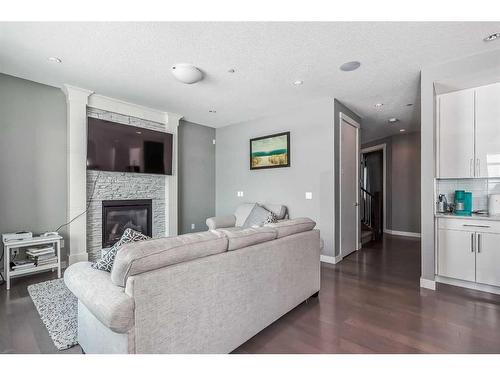 19 Lakewood Mews, Strathmore, AB - Indoor Photo Showing Living Room With Fireplace