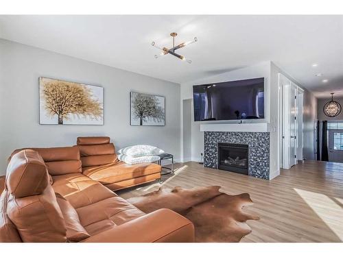 235 Carringham Road Nw, Calgary, AB - Indoor Photo Showing Living Room With Fireplace
