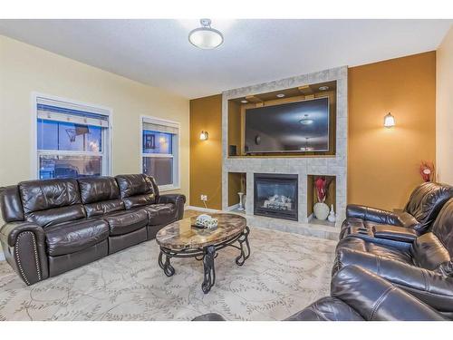 277 Martin Crossing Place Ne, Calgary, AB - Indoor Photo Showing Living Room With Fireplace