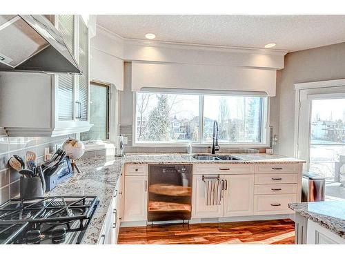 94 Mckenzie Lake Island Se, Calgary, AB - Indoor Photo Showing Kitchen With Double Sink