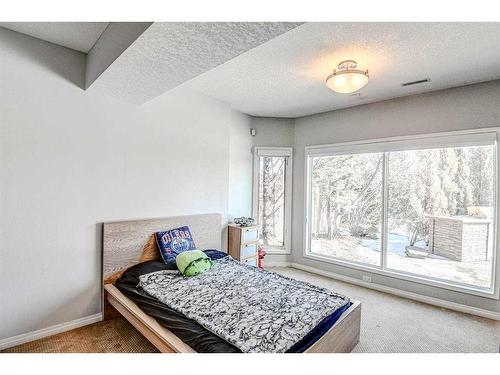 94 Mckenzie Lake Island Se, Calgary, AB - Indoor Photo Showing Bedroom