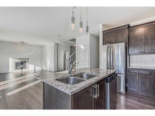 17 Covecreek Mews Ne, Calgary, AB - Indoor Photo Showing Kitchen With Double Sink With Upgraded Kitchen