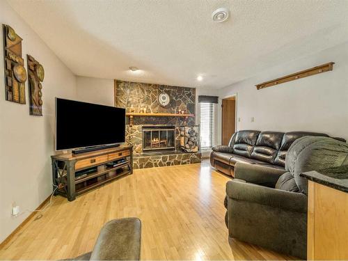 440 2 Avenue Ne, Milk River, AB - Indoor Photo Showing Living Room With Fireplace