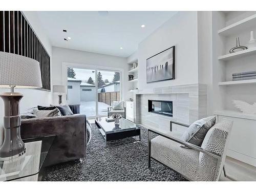 2-427 37 Street Sw, Calgary, AB - Indoor Photo Showing Living Room With Fireplace