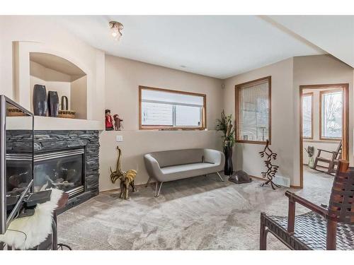 88 Somerglen Common Sw, Calgary, AB - Indoor Photo Showing Living Room With Fireplace