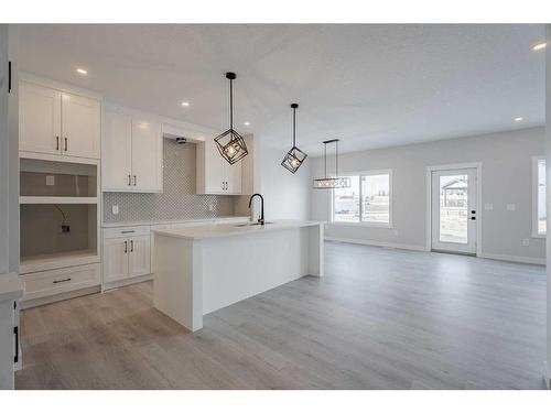 713 Mandalay Link, Carstairs, AB - Indoor Photo Showing Kitchen With Upgraded Kitchen