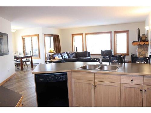 308-1160 Railway Avenue, Canmore, AB - Indoor Photo Showing Kitchen With Double Sink