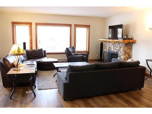 308-1160 Railway Avenue, Canmore, AB - Indoor Photo Showing Living Room With Fireplace