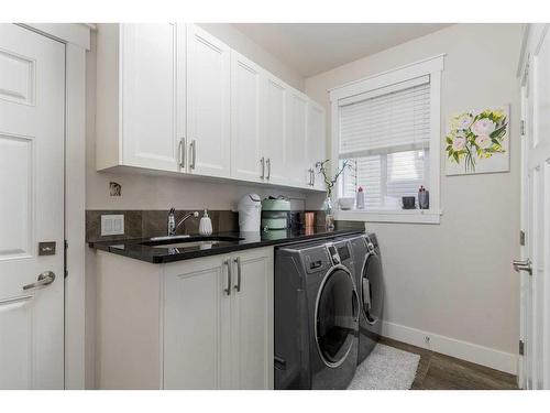 265 Kinniburgh Boulevard, Chestermere, AB - Indoor Photo Showing Laundry Room