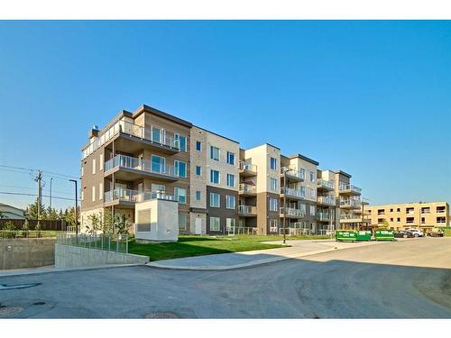208-200 Shawnee Square Sw, Calgary, AB - Outdoor With Facade