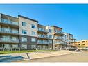 208-200 Shawnee Square Sw, Calgary, AB  - Outdoor With Facade 