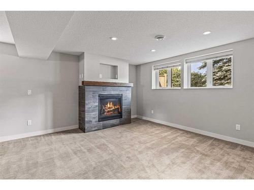 949 13Th Street, Canmore, AB - Indoor Photo Showing Living Room With Fireplace