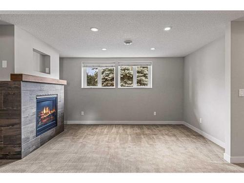 949 13Th Street, Canmore, AB - Indoor With Fireplace