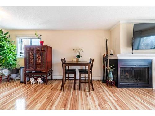 301-305 25 Avenue Sw, Calgary, AB - Indoor Photo Showing Living Room With Fireplace