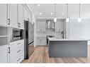 15 Saddlebred Court, Cochrane, AB  - Indoor Photo Showing Kitchen With Upgraded Kitchen 