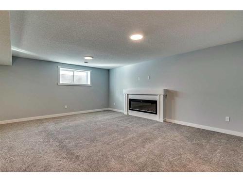 34 Hanson Drive, Langdon, AB - Indoor With Fireplace