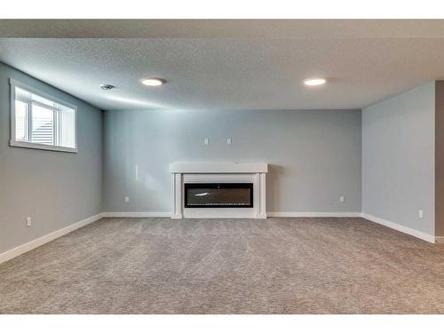 34 Hanson Drive, Langdon, AB - Indoor With Fireplace