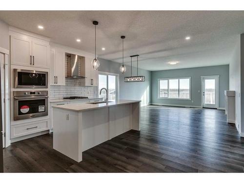 34 Hanson Drive, Langdon, AB - Indoor Photo Showing Kitchen With Upgraded Kitchen