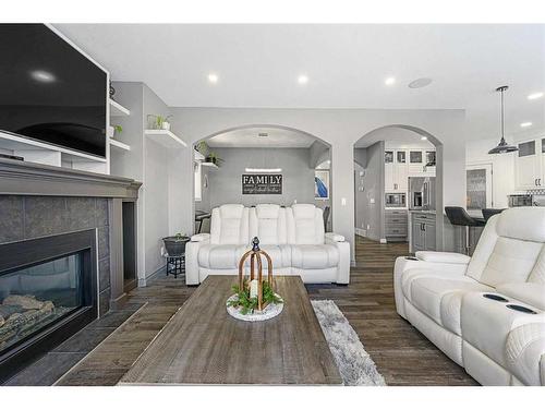 286 Taravista Drive Ne, Calgary, AB - Indoor Photo Showing Living Room With Fireplace