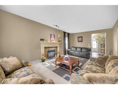 72 Sherwood Way Nw, Calgary, AB - Indoor Photo Showing Living Room With Fireplace