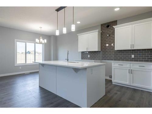 72 Key Cove, Airdrie, AB - Indoor Photo Showing Kitchen With Upgraded Kitchen