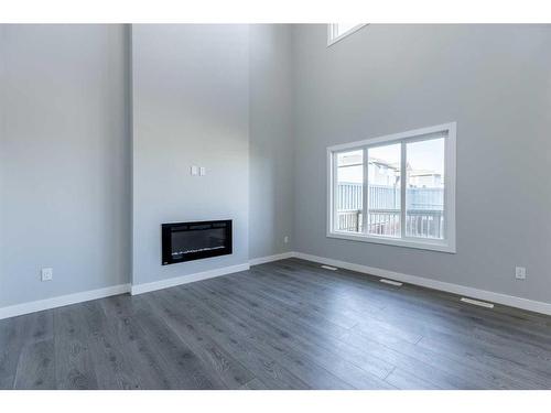 72 Key Cove, Airdrie, AB - Indoor Photo Showing Living Room With Fireplace