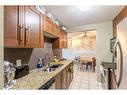 106-431 1 Avenue Ne, Calgary, AB  - Indoor Photo Showing Kitchen With Double Sink 