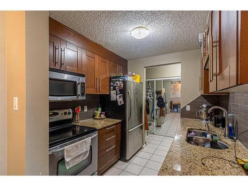 106-431 1 Avenue Ne, Calgary, AB - Indoor Photo Showing Kitchen With Double Sink