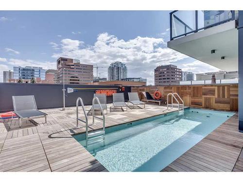 703-1010 6 Street Sw, Calgary, AB - Outdoor With In Ground Pool With Deck Patio Veranda