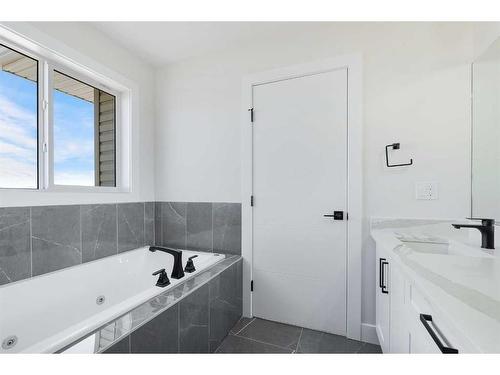 54 Hanson Drive Ne, Langdon, AB - Indoor Photo Showing Bathroom