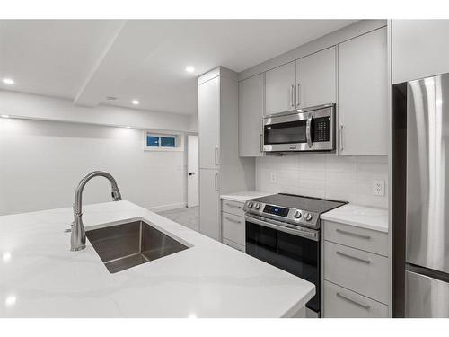 4747 26 Avenue Sw, Calgary, AB - Indoor Photo Showing Kitchen With Stainless Steel Kitchen With Double Sink