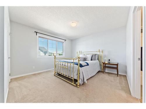 206-620 Luxstone Landing Sw, Airdrie, AB - Indoor Photo Showing Bedroom