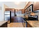 206-620 Luxstone Landing Sw, Airdrie, AB  - Indoor Photo Showing Kitchen 