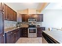 206-620 Luxstone Landing Sw, Airdrie, AB  - Indoor Photo Showing Kitchen 