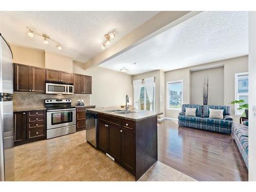 206-620 Luxstone Landing Sw, Airdrie, AB - Indoor Photo Showing Kitchen With Double Sink