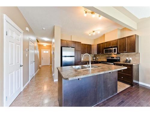 206-620 Luxstone Landing Sw, Airdrie, AB - Indoor Photo Showing Kitchen