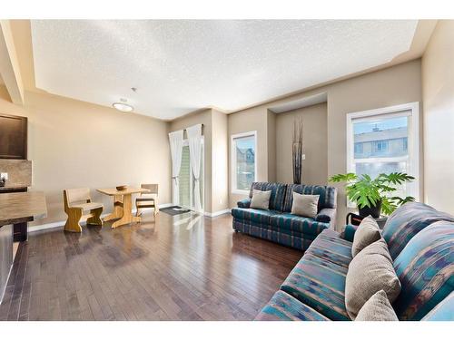 206-620 Luxstone Landing Sw, Airdrie, AB - Indoor Photo Showing Living Room