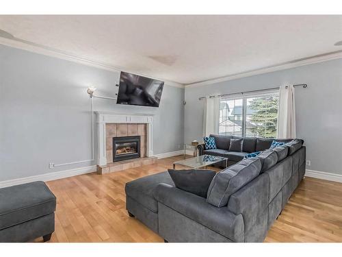 62 Kingston Drive, Red Deer, AB - Indoor Photo Showing Living Room With Fireplace
