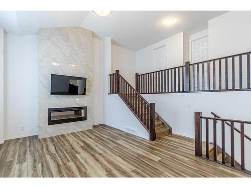 227 Carringham Road Nw, Calgary, AB - Indoor With Fireplace