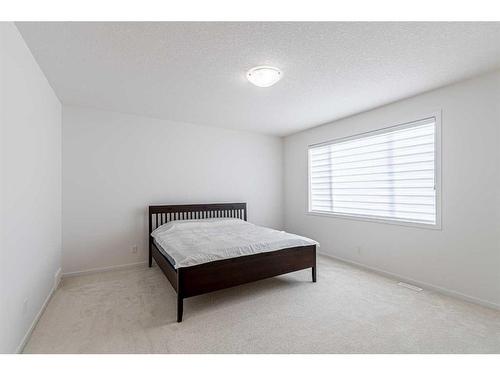227 Carringham Road Nw, Calgary, AB - Indoor Photo Showing Bedroom