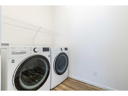 227 Carringham Road Nw, Calgary, AB - Indoor Photo Showing Laundry Room