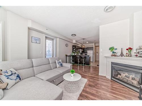 203-1507 Centre A Street, Calgary, AB - Indoor Photo Showing Living Room With Fireplace