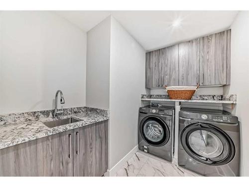 150 Sandpiper Park, Chestermere, AB - Indoor Photo Showing Laundry Room