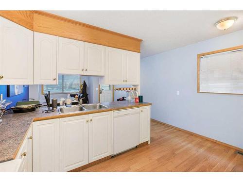 1-642 Mcdougall Road Ne, Calgary, AB - Indoor Photo Showing Kitchen With Double Sink