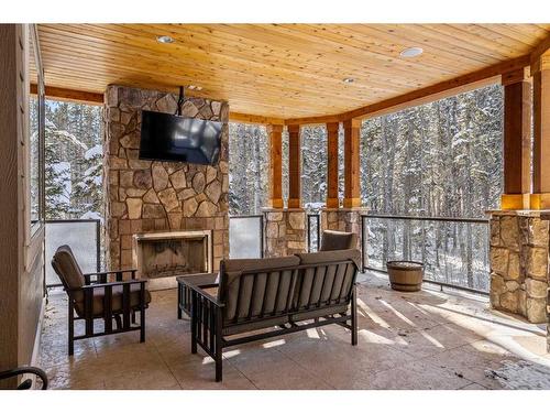207 Hawk'S Landing Rise, Priddis Greens, AB -  With Fireplace With Deck Patio Veranda With Exterior
