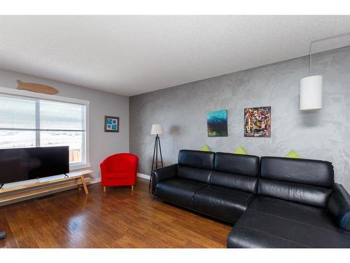 191 Sunrise View, Cochrane, AB - Indoor Photo Showing Living Room