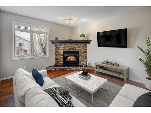 64 Valley Meadow Close Nw, Calgary, AB - Indoor Photo Showing Living Room With Fireplace